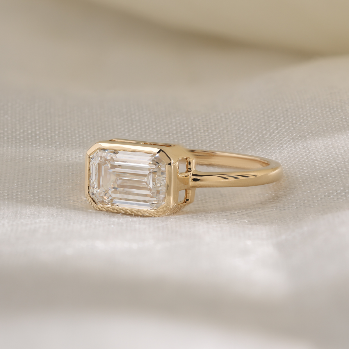 emerald bezel solitaire ring