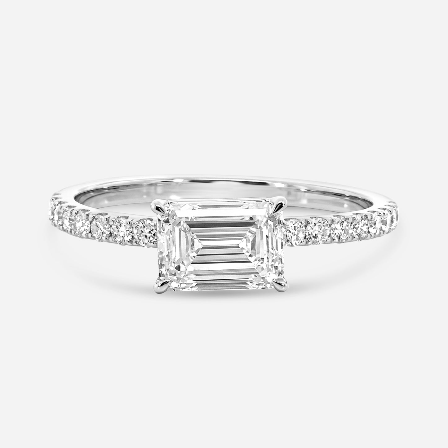 emerald e/w solitaire on pave setting