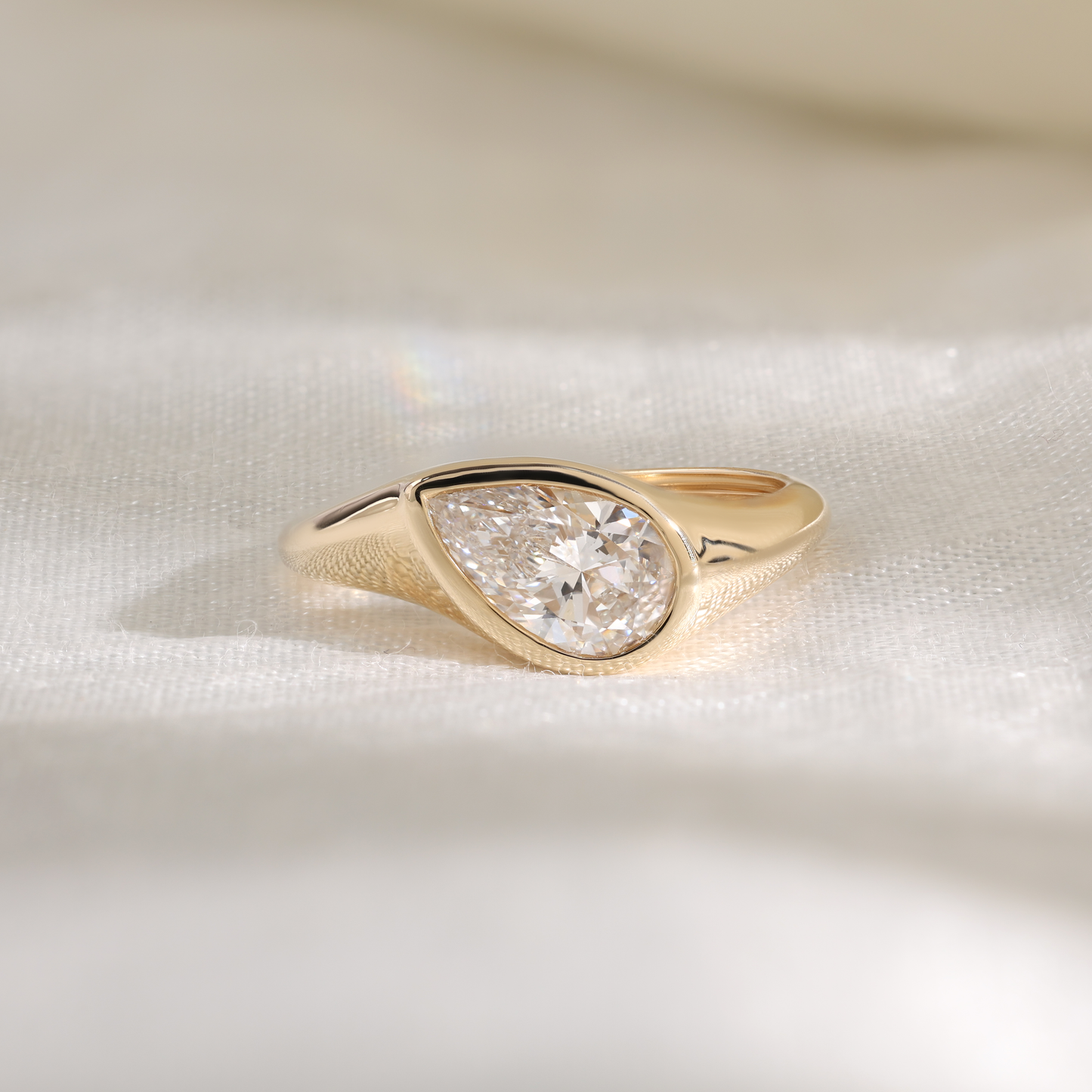 1.2ct pear slanted bezel ring