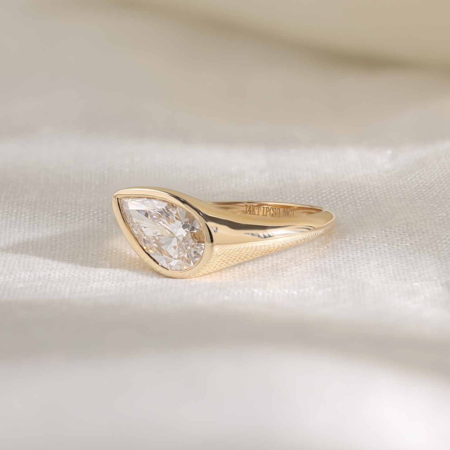 1.2ct pear slanted bezel ring