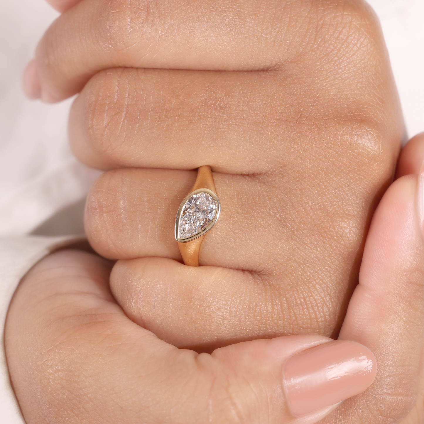 1.2ct pear slanted bezel ring
