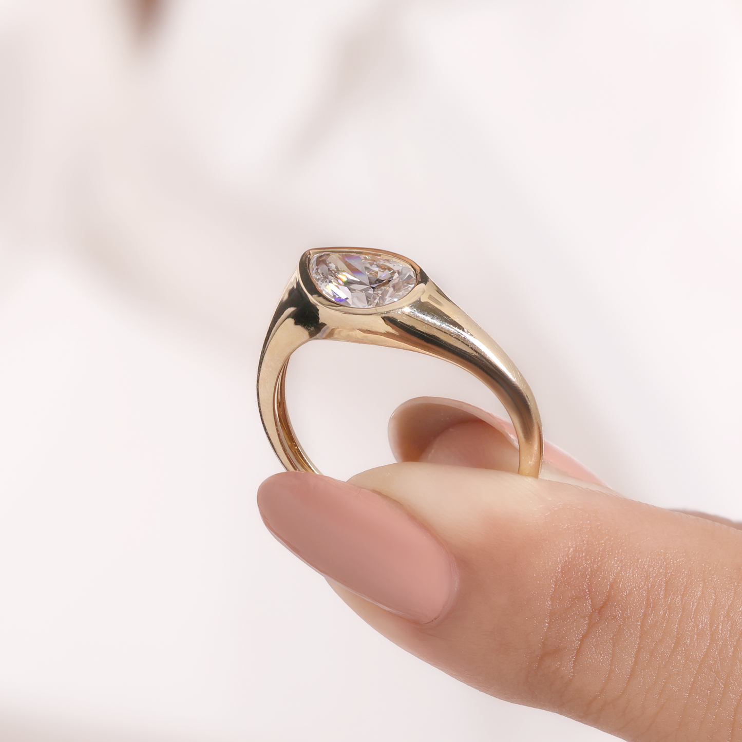 1.2ct pear slanted bezel ring